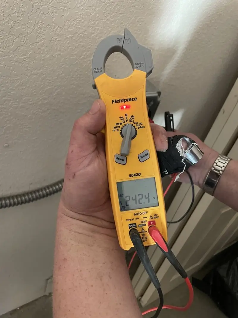 Voltage testing with clamp meter during Ceiling Fan Installation in Hyrum